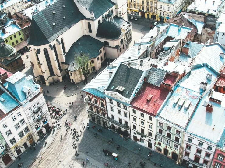 a view of a city from a bird's eye view, a photo, by Emma Andijewska, pexels contest winner, art nouveau, market square, 000 — википедия, on a bright day, zdzislaw belsinki