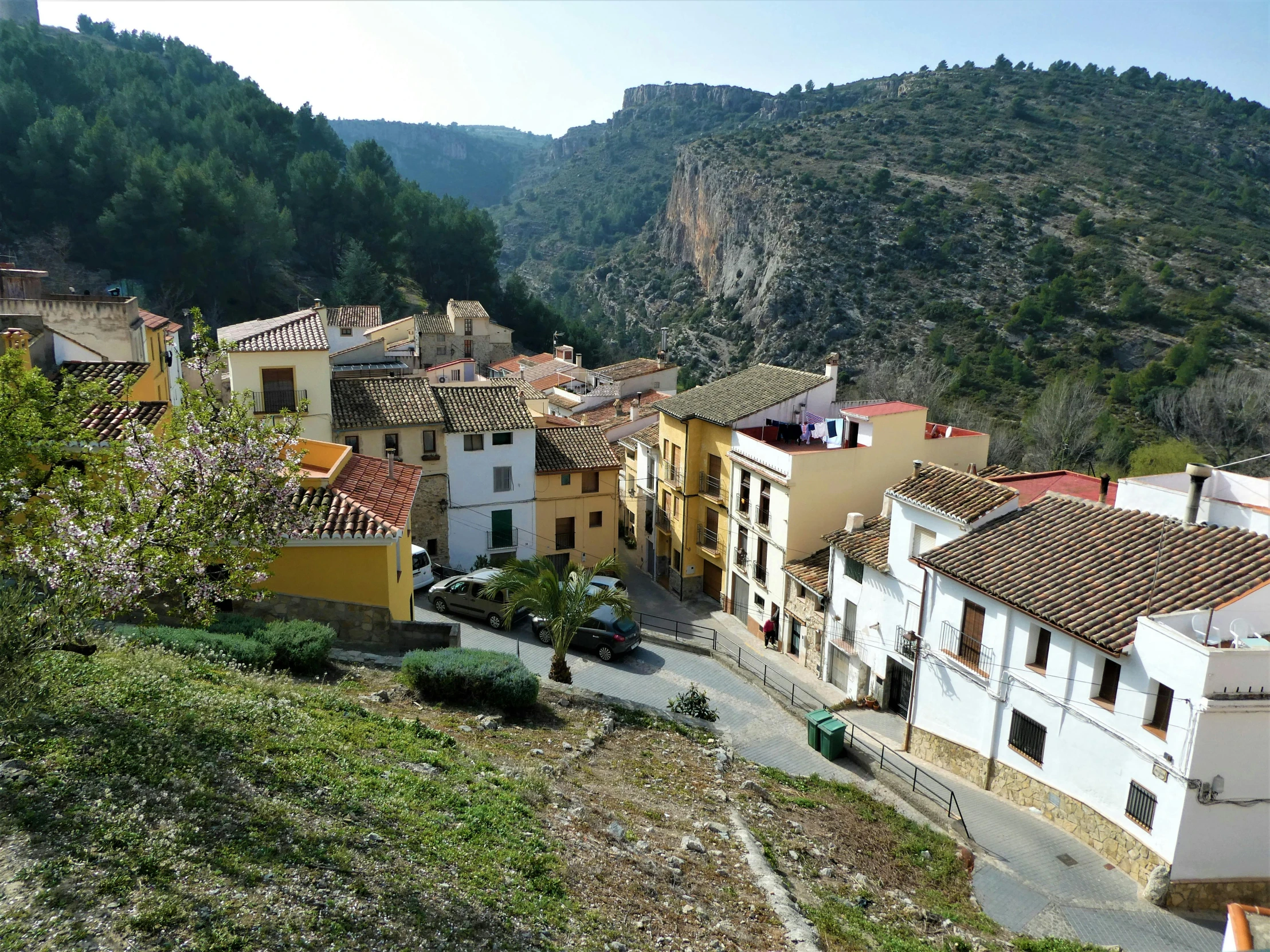 a view of a town from the top of a hill, inspired by Joaquín Clausell, instagram, exterior view, las pozas, white, ochre