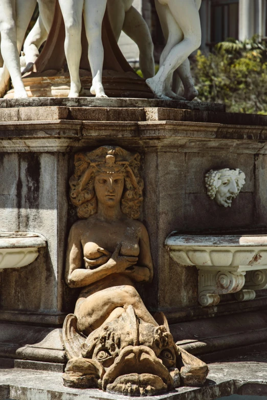 a couple of statues sitting on top of a fountain, ornate furniture, in savannah, head details, circe