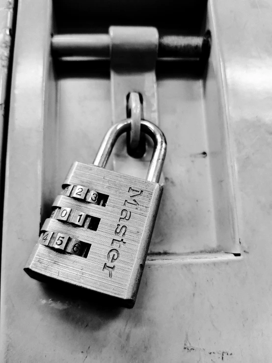 a black and white photo of a padlock, by Adam Marczyński, private press, locker room, instagram post, server, masterpiece
