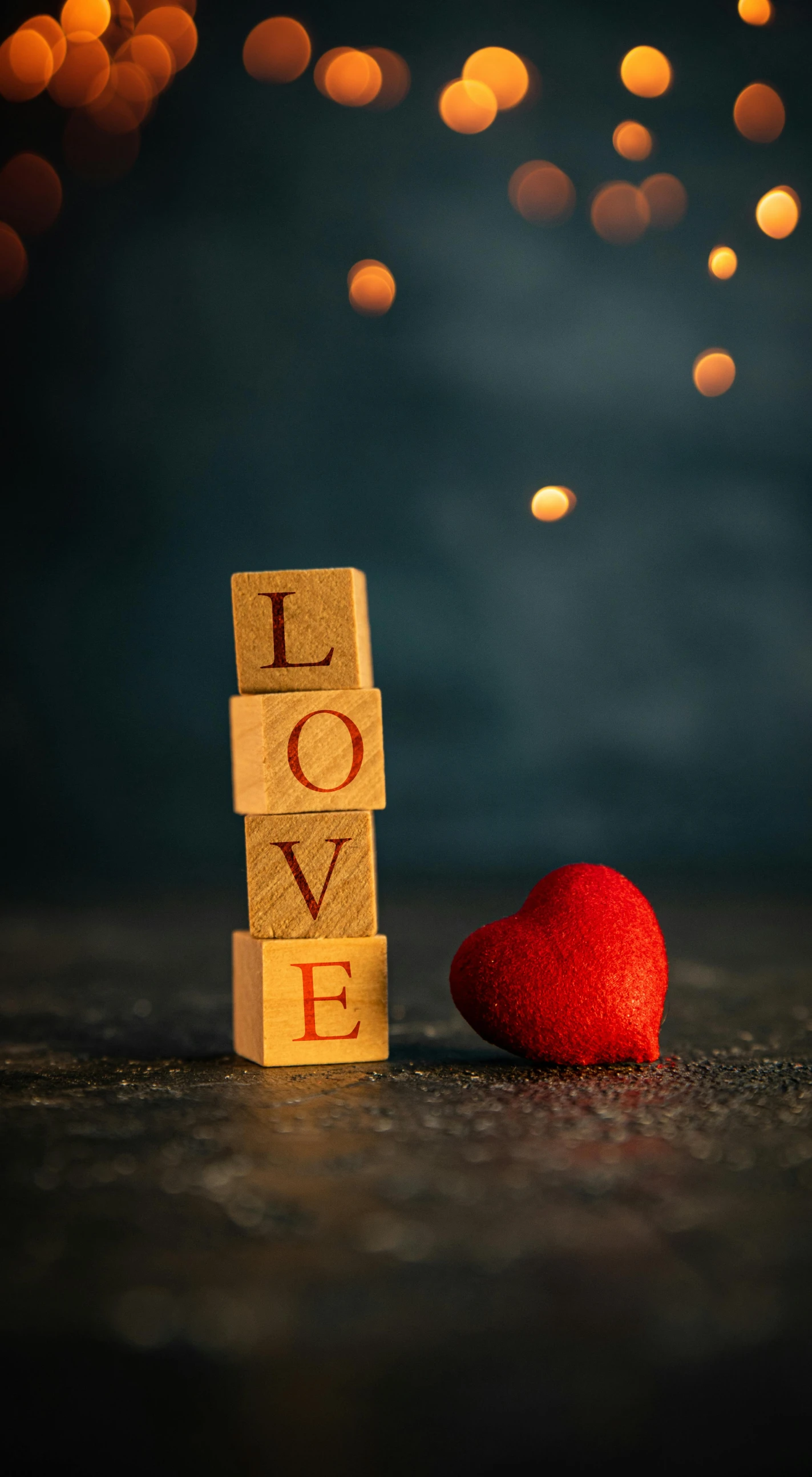 a wooden block with the word love next to a red heart, by Julia Pishtar, romanticism, bokeh photograph, square, demur, paul barson