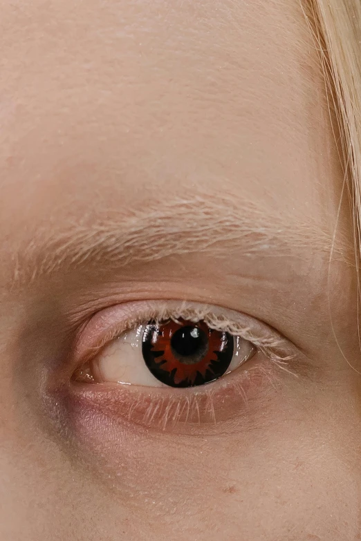 a close up of a person with a red eye