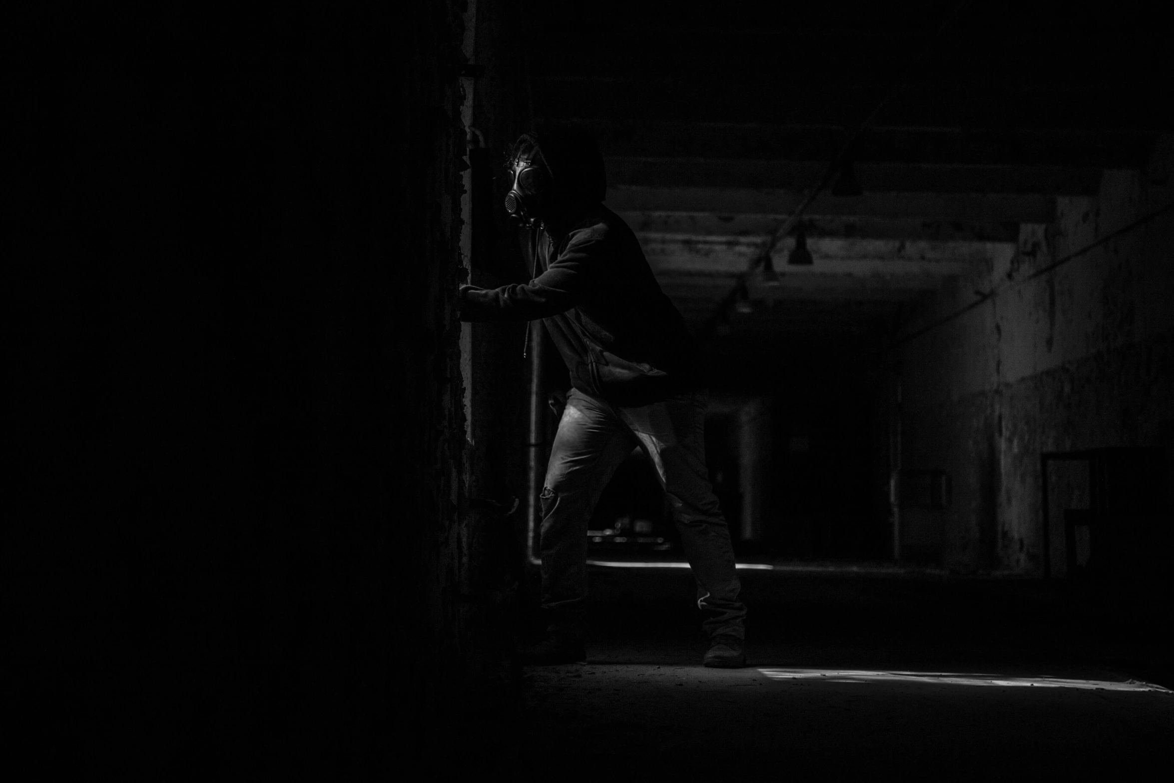 a man that is standing in the dark, by Kristian Kreković, pexels contest winner, graffiti, theft, hunting, indoor picture, fight pose