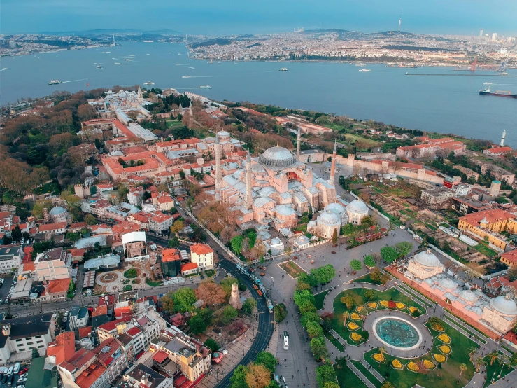 an aerial view of a city with lots of buildings, a colorized photo, pexels contest winner, hurufiyya, turkish and russian, 🚿🗝📝