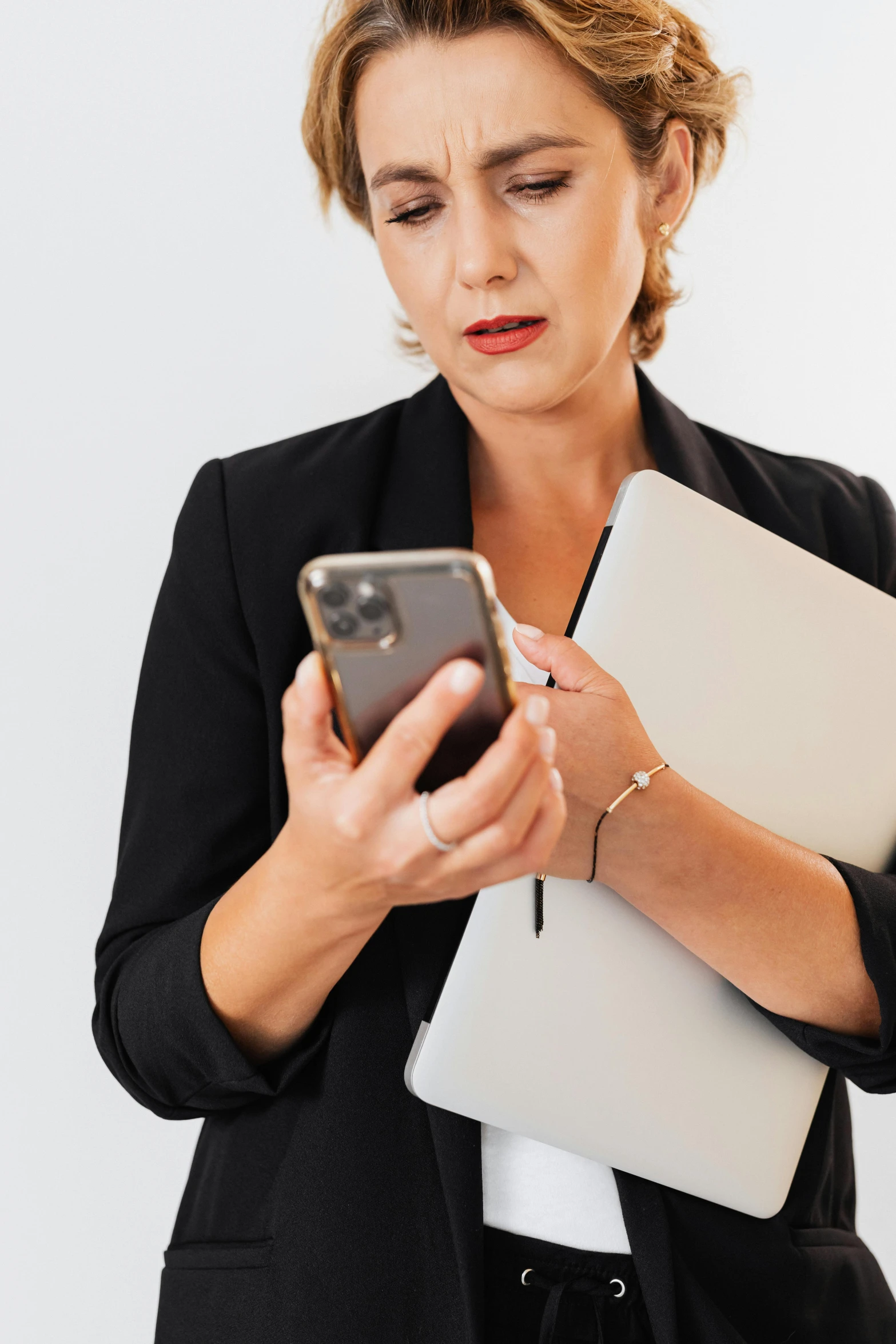 a woman in a business suit looking at her cell phone, a picture, trending on pexels, renaissance, middle - age, 15081959 21121991 01012000 4k, holding a briefcase, plain background