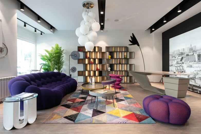 a living room filled with furniture and a colorful rug, inspired by david rubín, unsplash, purple tornado, suspended ceiling, neo kyiv, black show room