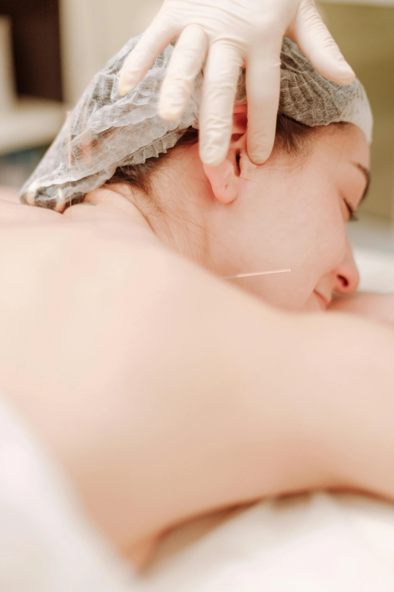 a woman getting a facial massage at a spa, an album cover, shutterstock, renaissance, acupuncture treatment, grayish, resting on chest, thumbnail