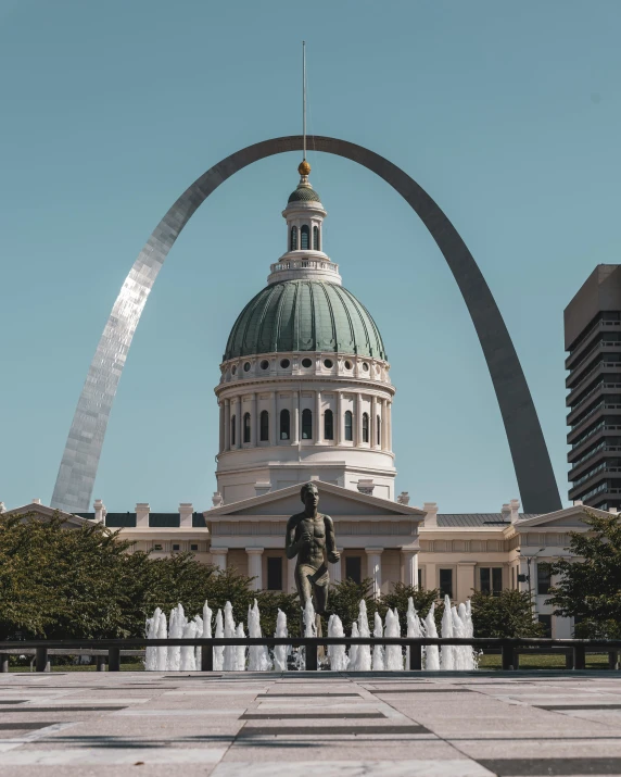 a large building with a fountain in front of it, a statue, unsplash contest winner, midwest town, massive arch, 🚿🗝📝, lesbians