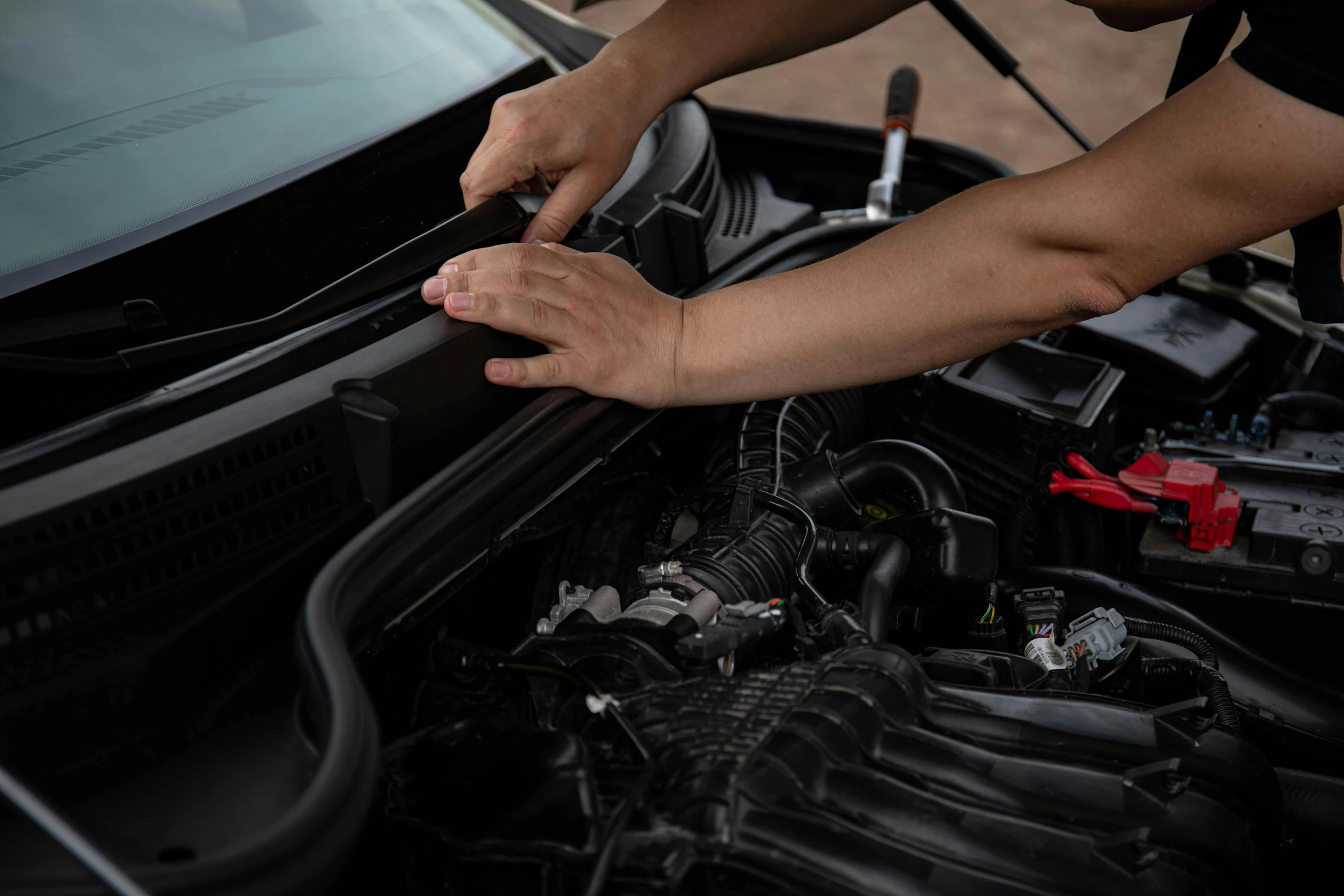 a man fixing the hood of a car, pexels contest winner, veins popping out, holding a battery, 15081959 21121991 01012000 4k, ureal engine