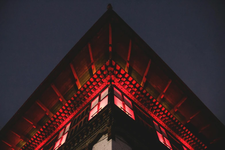 a clock tower lit up with red lights, unsplash contest winner, minimalism, tibetan inspired architecture, intricate detailed roof, deep colours. ”, lit. 'the cube'