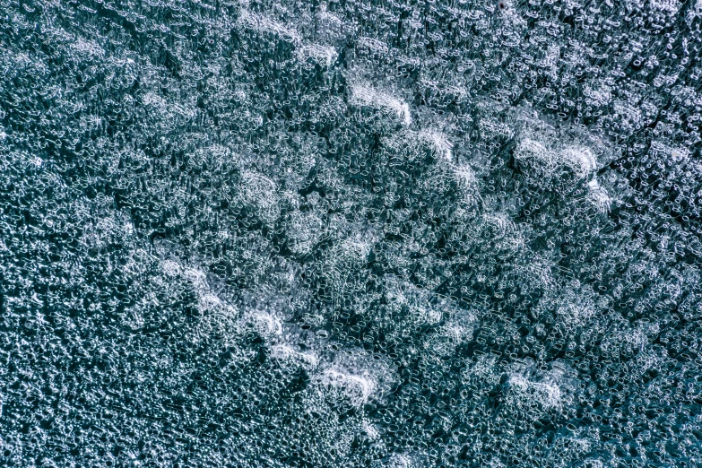 a close up of a snow covered surface, inspired by Vija Celmins, unsplash, kinetic pointillism, chalked, thumbnail, drone photo, ron cobb