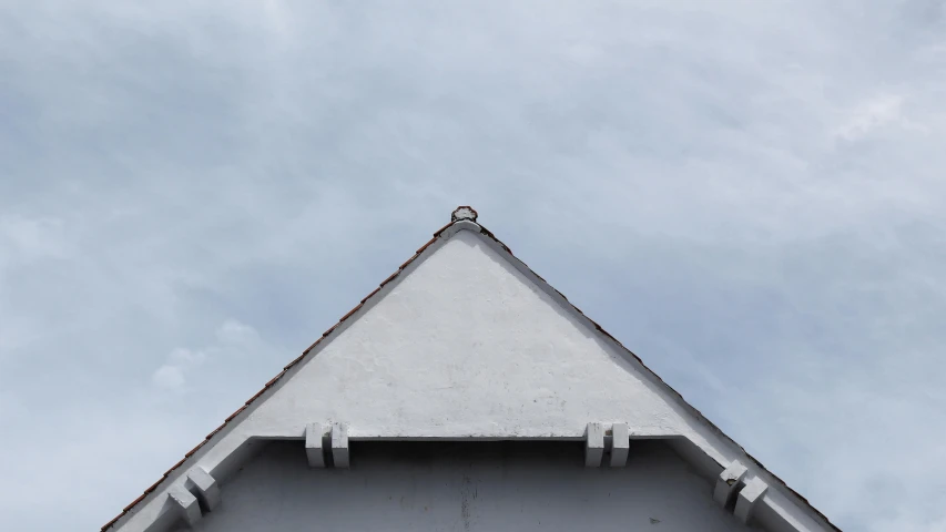 a clock that is on the side of a building, inspired by Storm Thorgerson, unsplash, postminimalism, simple gable roofs, white and grey, seaview, triangle