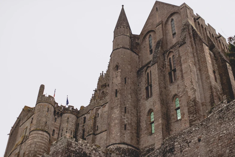 a tall building with a clock on top of it, pexels contest winner, renaissance, normandy, gloomy medieval background, giant castle walls, thumbnail