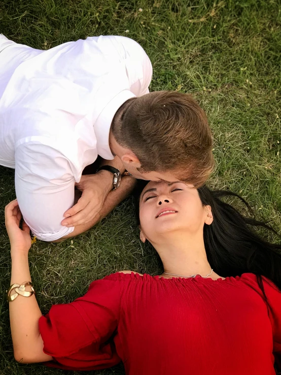 a man and a woman laying in the grass, by Julia Pishtar, pexels contest winner, happening, russian girlfriend, asian male, 15081959 21121991 01012000 4k, making out