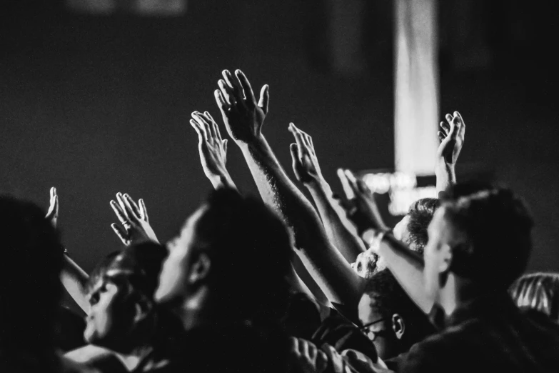 a black and white photo of a crowd of people raising their hands, pexels, christianity, tabernacle deep focus, instagram post, looking upwards