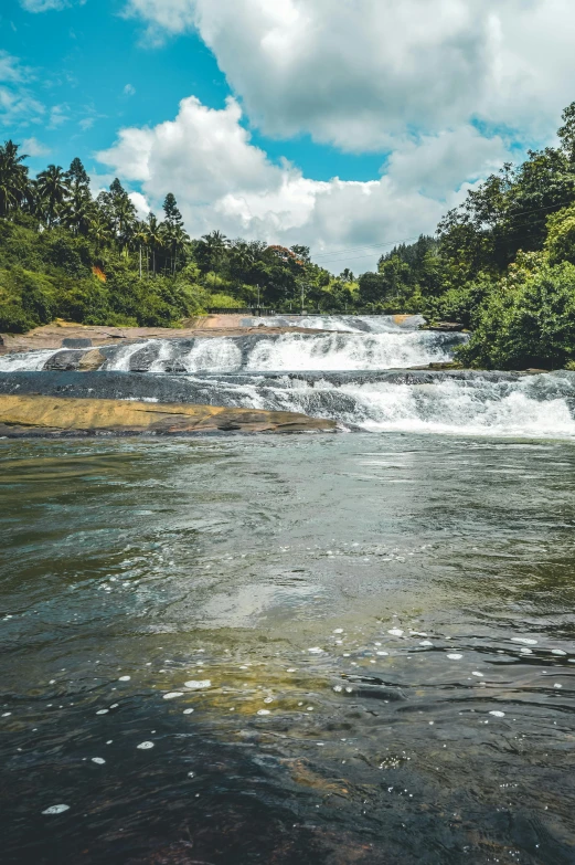 a man riding a surfboard on top of a river, hurufiyya, with trees and waterfalls, sri lankan landscape, slide show, multiple stories