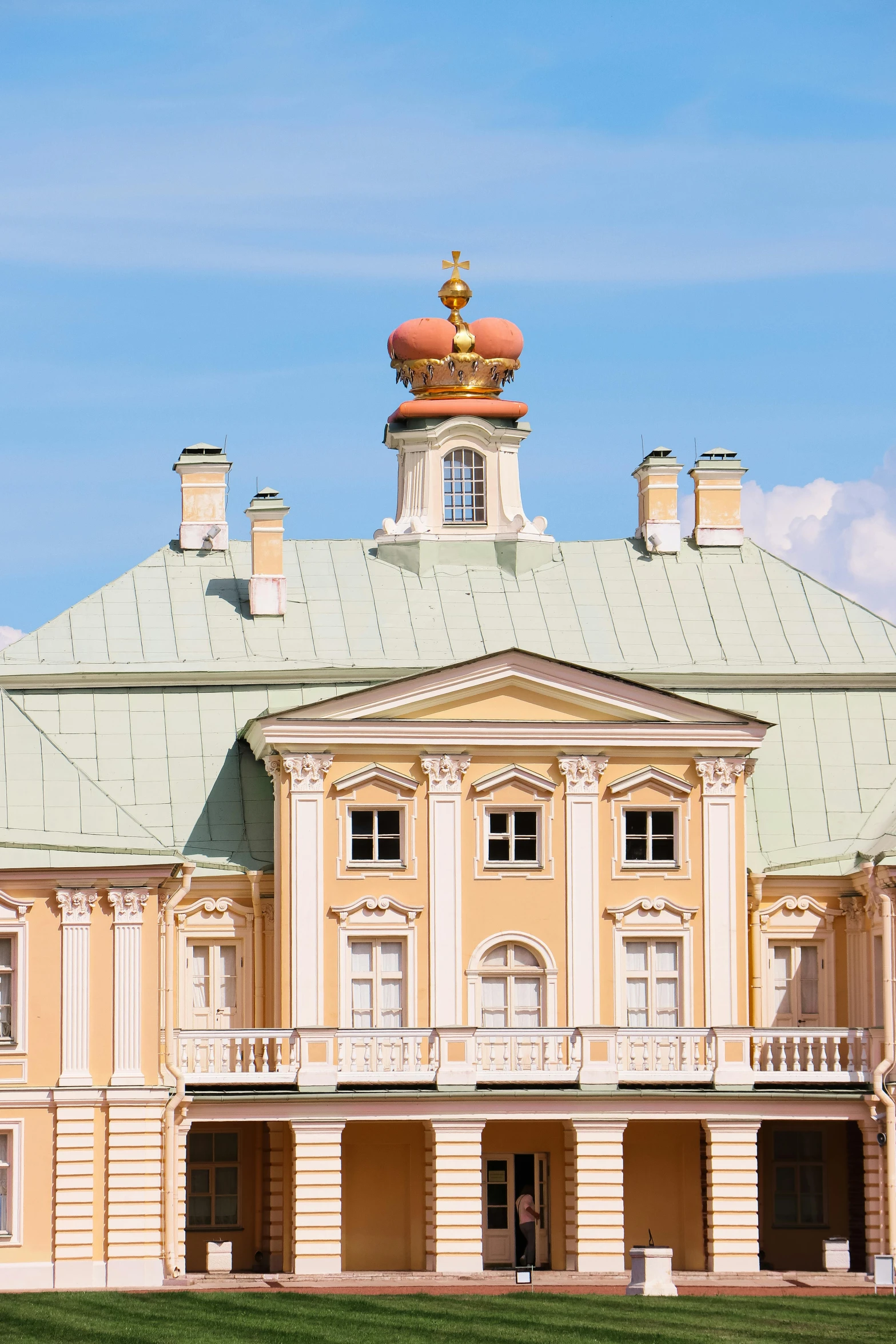 a large building sitting on top of a lush green field, rococo, large crown helmet, golden windows, profile putin, exterior