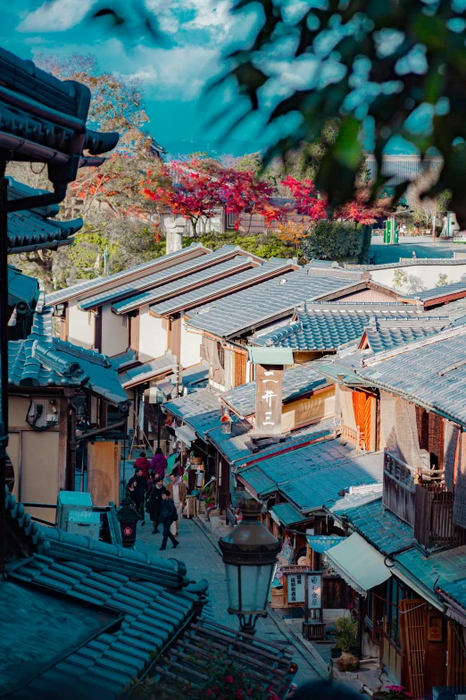 a group of people walking down a street next to tall buildings, inspired by Miyagawa Isshō, trending on unsplash, mingei, view of villages, korean traditional palace, shot from roofline, square