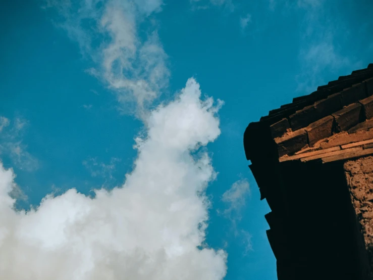 a close up of a building with a sky background, pexels contest winner, romanesque, background image, cloud palace, chimney, dynamic low angle shot