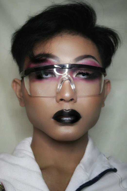 a close up of a person wearing glasses, inspired by Russell Dongjun Lu, tumblr, afrofuturism, with black glossy lips, set on singaporean aesthetic, genderless, award winning makeup