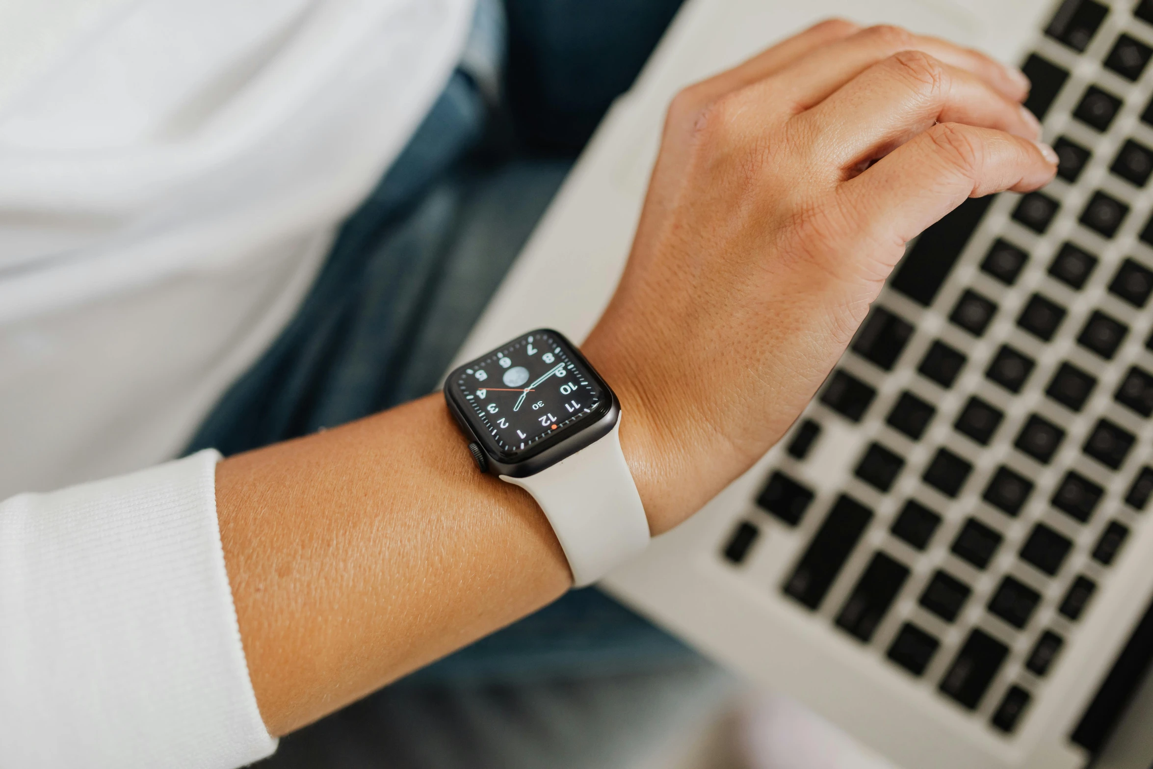 a close up of a person typing on a laptop, a cartoon, trending on pexels, renaissance, wears a watch, white sleeves, holding an apple, stylish pose