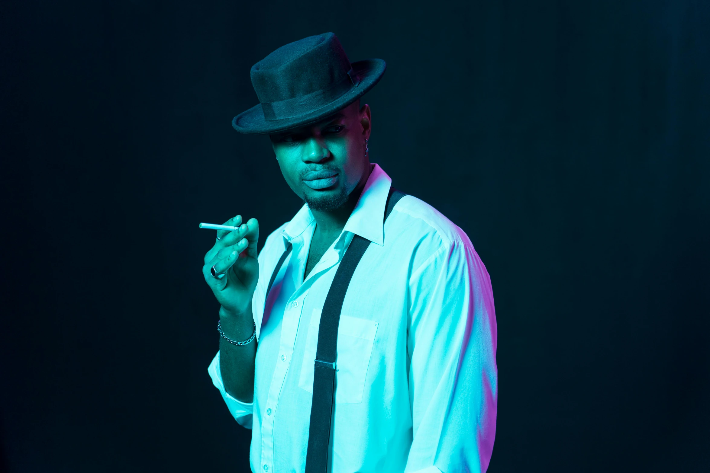 a man in a white shirt and tie smoking a cigarette, an album cover, inspired by Theo Constanté, unsplash, harlem renaissance, blue fedora, shot at dark with studio lights, neon noir, photo from a promo shoot