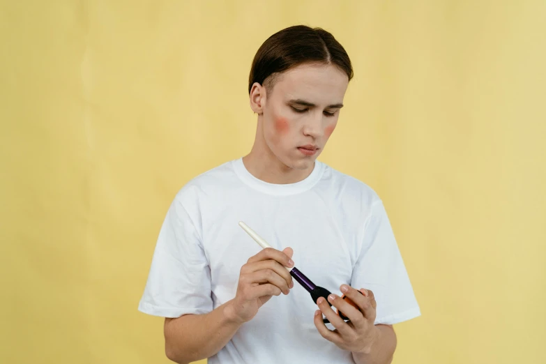 a man in a white shirt holding a toothbrush, an airbrush painting, by Attila Meszlenyi, trending on pexels, 90s make-up, yung lean, set photo