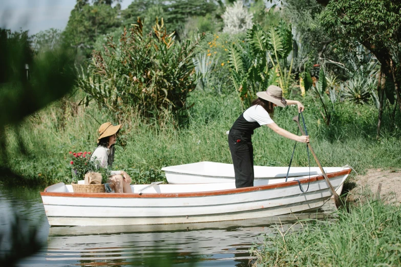 a couple of people that are in a boat, inspired by Frederick McCubbin, unsplash, gardening, still from l'estate, conde nast traveler photo, ecovillage