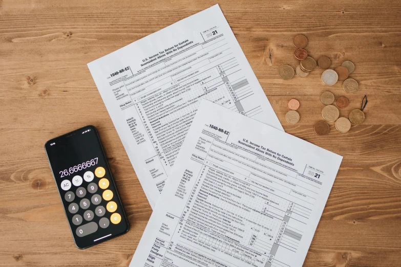 a calculator sitting on top of a wooden table, character sheets on table, illustration », multiple stories, wētā fx