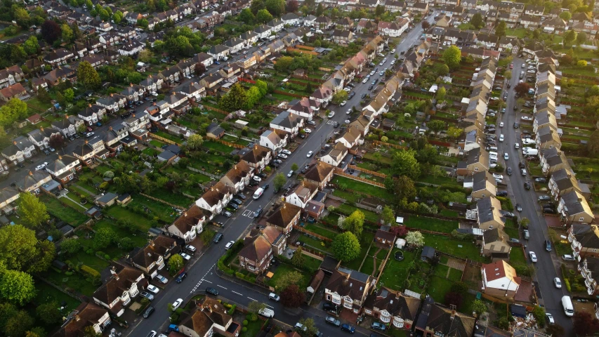 an aerial view of a city with lots of houses, by Julian Allen, shutterstock, barnet, hedges, suburbia street, 1 petapixel image