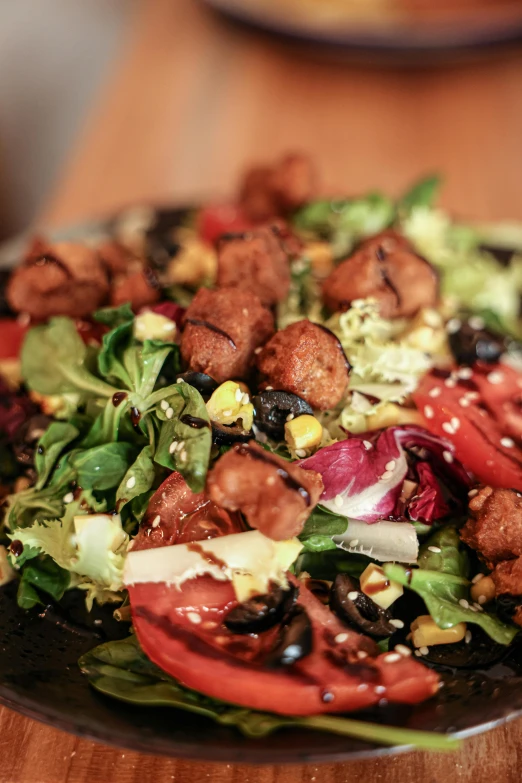 a close up of a plate of food on a table, salad, profile image, angled, reds