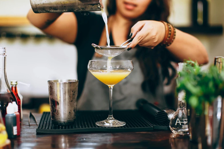 a woman pouring a cocktail into a glass, pexels contest winner, renaissance, avatar image, aussie baristas, 2000s photo, profile picture