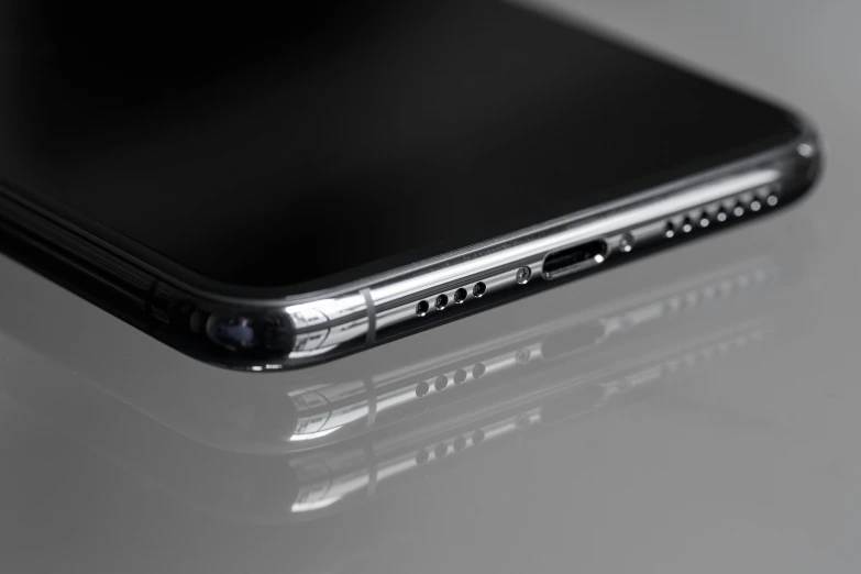 a close up of a cell phone on a table, by Daniel Lieske, glossy shiny reflective, profile image, high resolution ultradetailed, wallpaper - 1 0 2 4