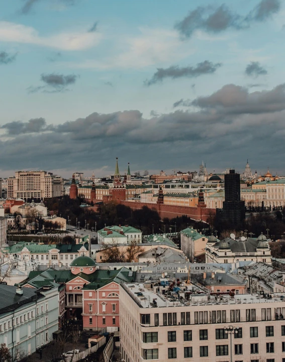 a view of a city from the top of a building, by Emma Andijewska, pexels contest winner, socialist realism, kremlin, cover image, high quality photo