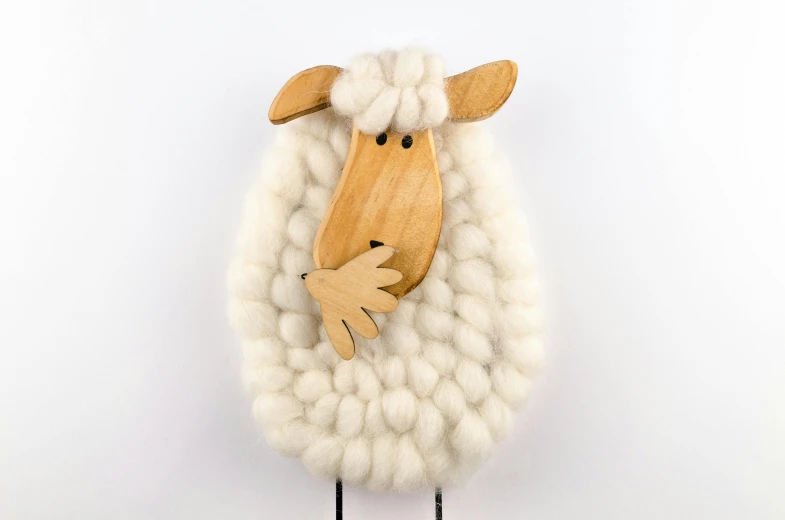 a close up of a sheep on a white background, by Elaine Hamilton, unsplash, folk art, wooden decoration, cloud hair, intarsia, 3/4 front view
