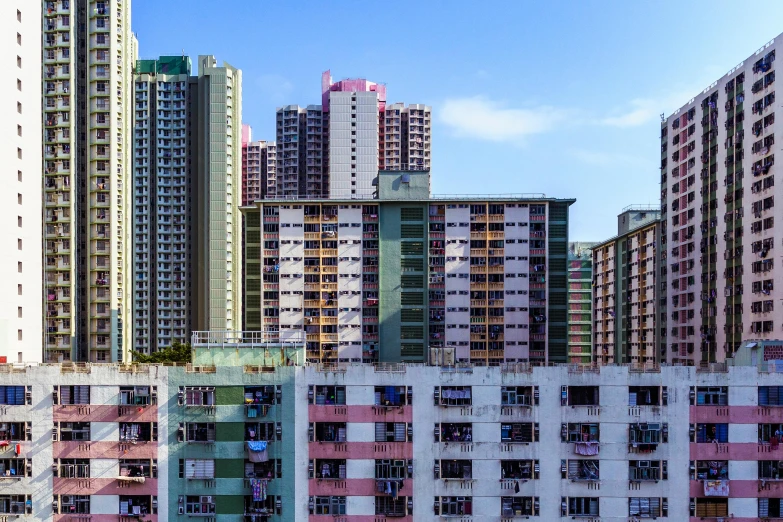 a group of tall buildings sitting next to each other, a colorized photo, pexels contest winner, hyperrealism, chinese architecture, concrete housing, settlement, ten flats