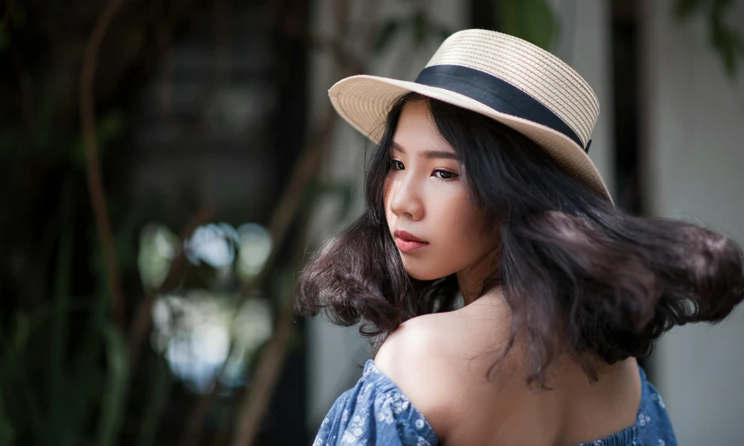 a close up of a person wearing a hat, inspired by Itō Shinsui, pexels contest winner, asian girl, casual pose, malaysian, avatar image