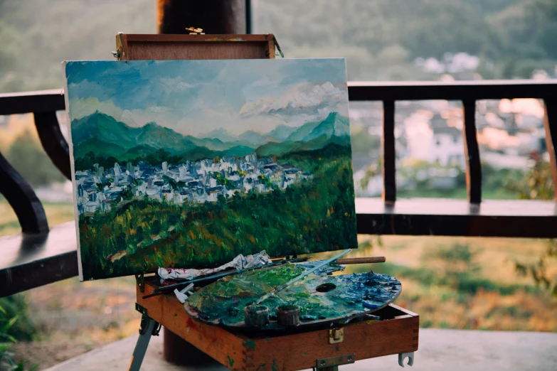 a painting sitting on top of a wooden easel, by Julia Pishtar, pexels contest winner, overlooking a valley, do hoang tuong artwork, palette knife! and brush strokes, city views