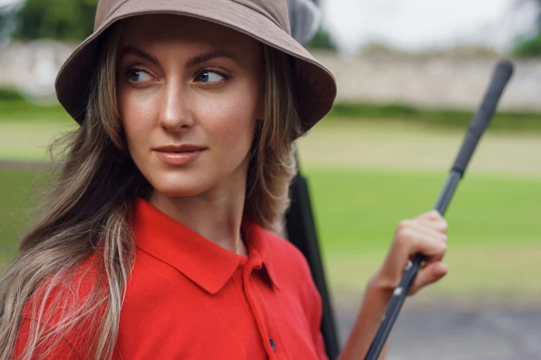 a woman wearing a hat and holding a golf club, profile image, wearing polo shirt, stunning beauty, thumbnail