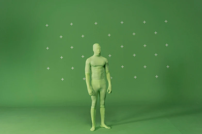 a mannequin standing in front of a green background, inspired by Russell Dongjun Lu, polycount, with stars, zentai suit, muted green, background(solid)