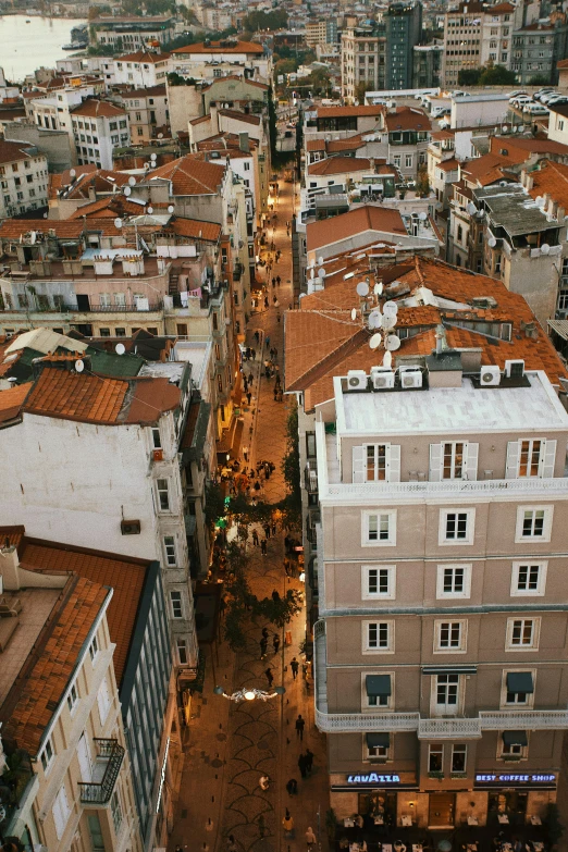 a view of a city from the top of a building, inspired by Almada Negreiros, pexels contest winner, renaissance, detailed street, photograph from above, in the evening, square