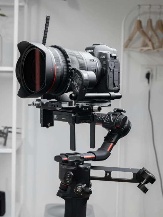 a close up of a camera on a tripod, extended robotic arms, sony a7z, sony a7r iii, b - roll