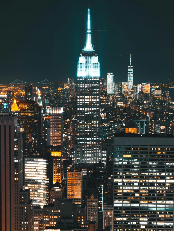 a view of a city at night from the top of a building