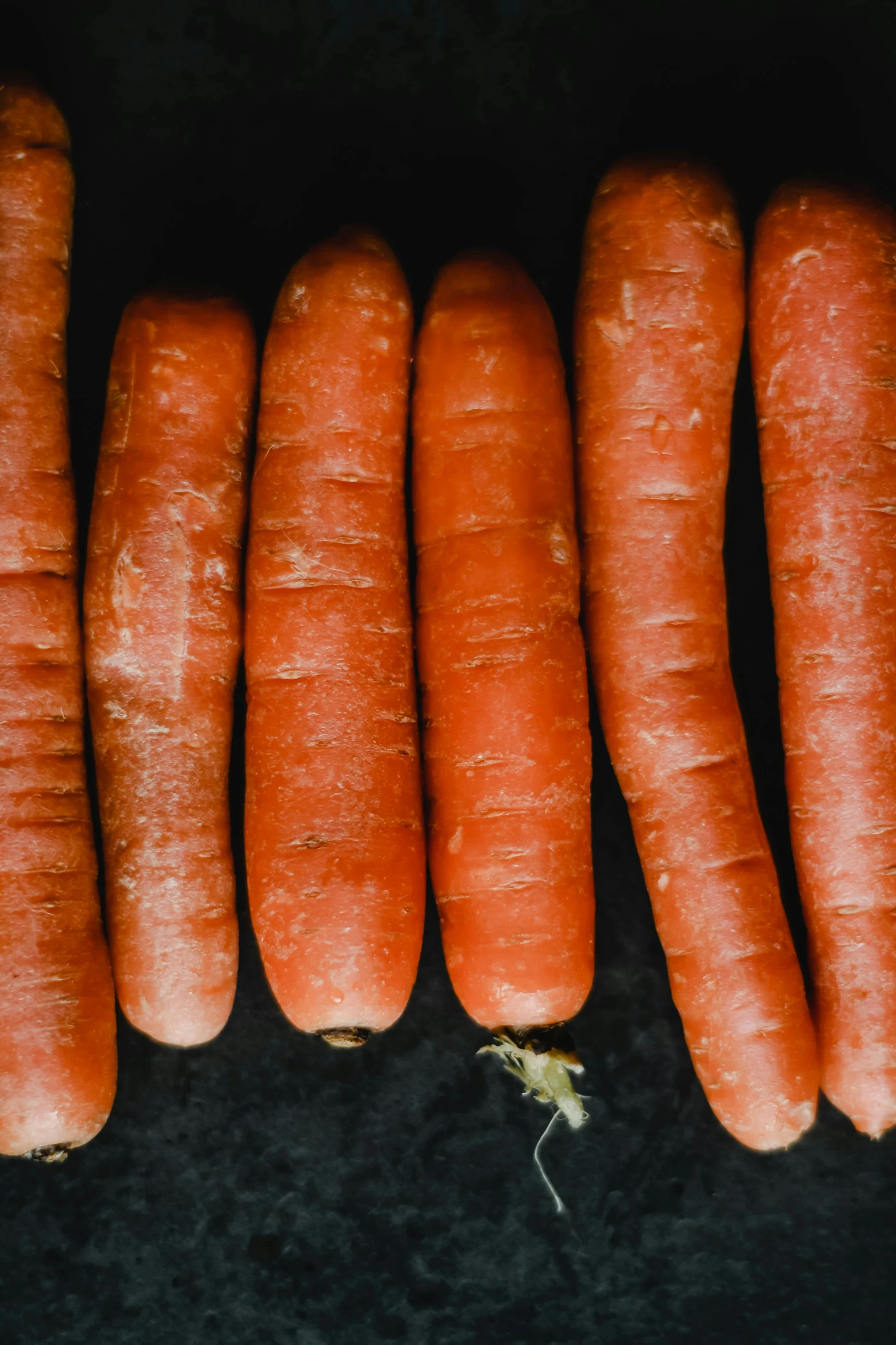 a bunch of carrots sitting on top of a table, thumbnail, uncropped, holes, f / 2. 5