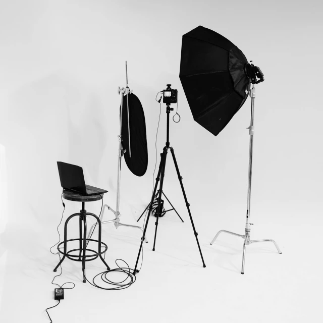 a black and white photo of a photo studio, by Kristian Zahrtmann, pexels, white backdrop, 3 light sources, cinematic outfit photo, video footage