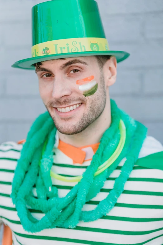 a man wearing a green hat and scarf, a photo, inspired by Mór Than, trending on reddit, jackstraws, prideful, promo photo, square