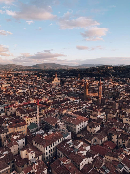 an aerial view of a city with a clock tower, by Daniel Lieske, pexels contest winner, renaissance, florence, late summer evening, 💋 💄 👠 👗, 4 k cinematic panoramic view