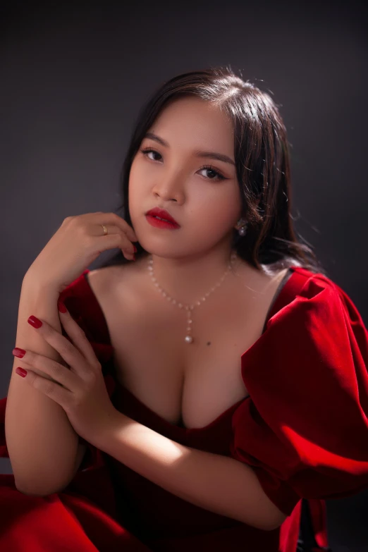 a woman in a red dress posing for a picture, an album cover, inspired by Ruth Jên, cleavage, 🤤 girl portrait, trending on bbwchan, 19-year-old girl