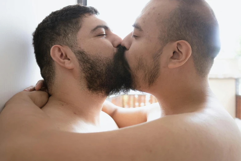 a couple of men that are kissing each other, waxed beard, looking outside, julian calle, covered in