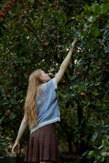 a girl reaching up to pick berries from a tree, inspired by Elsa Beskow, unsplash, renaissance, still from a live action movie, sadie sink, ignant, with apple